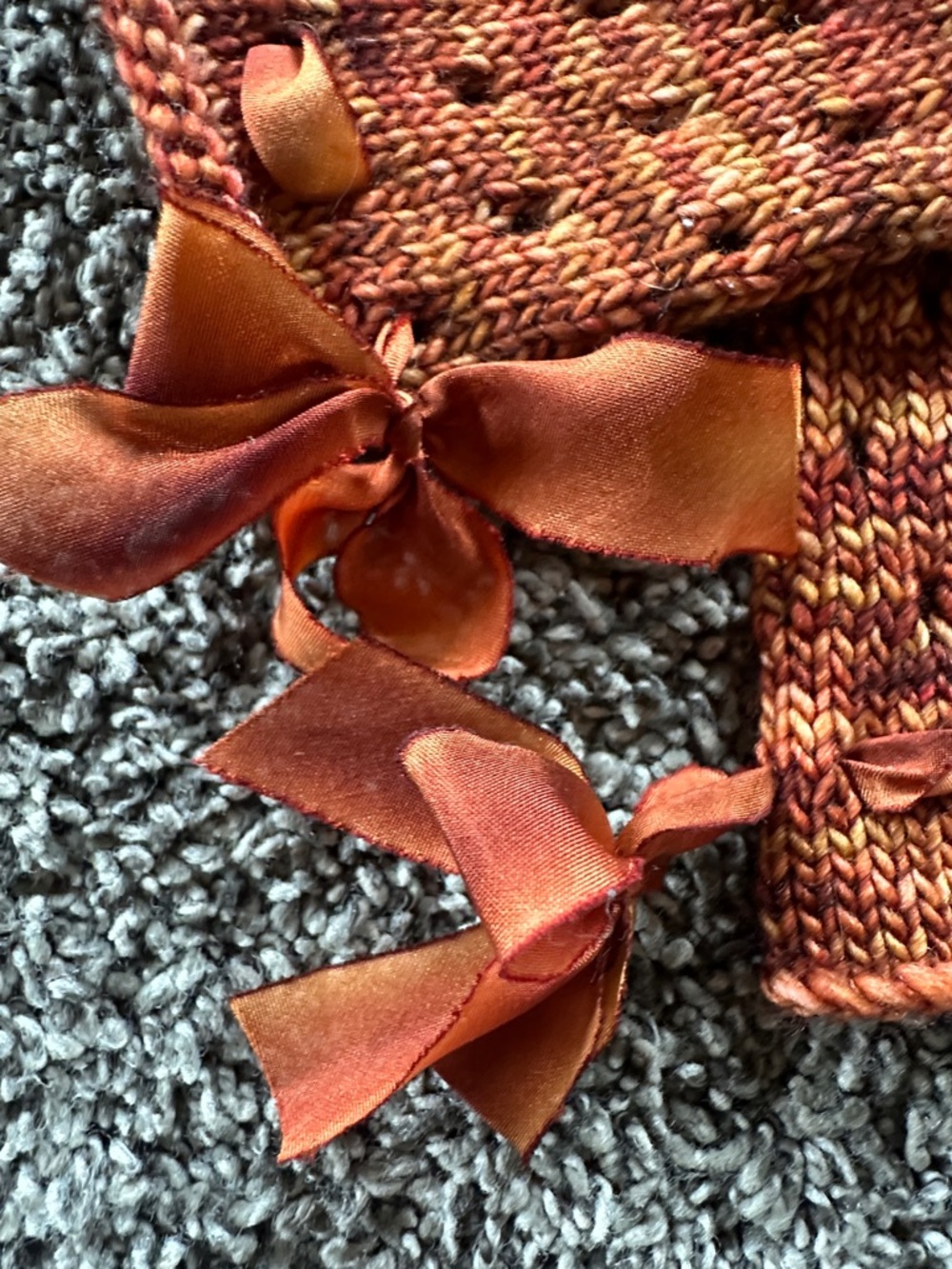 Hand-Knit Rust Orange Fingerless Gloves with Ribbon Detail - Picture 4 of 5